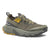 Olive green trail running shoe with yellow accents and aggressive tread sole, side view