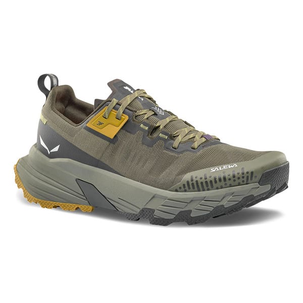 Olive green trail running shoe with yellow accents and aggressive tread sole, side view