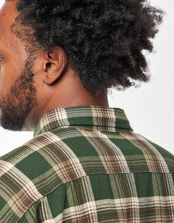 Back detail view of men's plaid flannel shirt with collar, green and brown tartan pattern