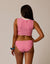 Women's striped pink and white bikini bottom with mid-rise coverage, back view