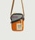 Small crossbody bag with colorblock design featuring orange base, gray top panel, and adjustable shoulder strap