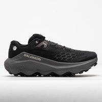 Black trail running shoe with chunky gray midsole and aggressive lug outsole, lateral view