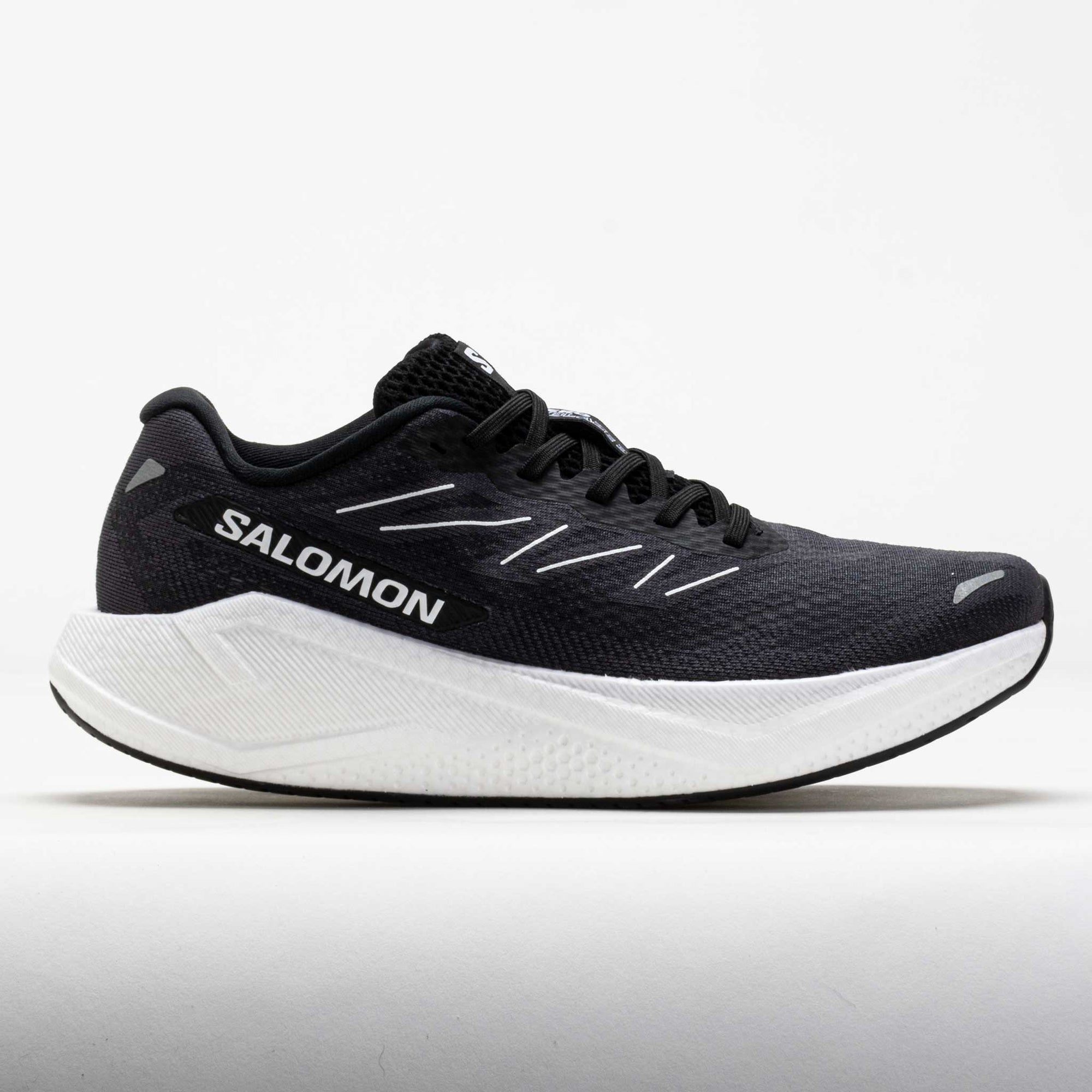 Dark gray running shoe with white midsole, side profile view showing mesh upper and laces