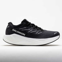 Dark gray running shoe with white midsole, side profile view showing mesh upper and laces