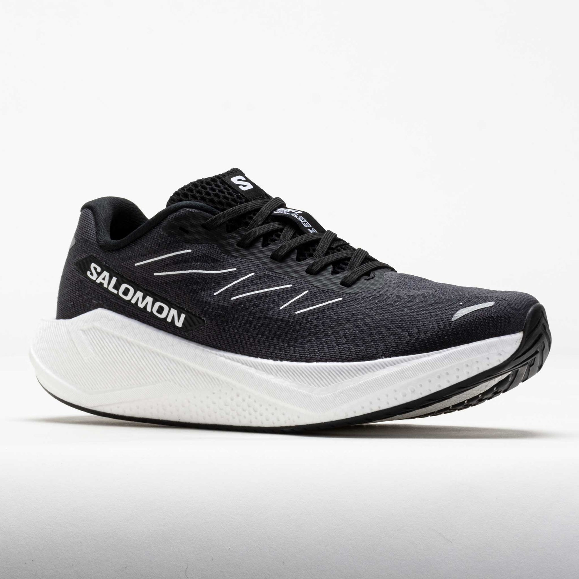 Dark gray running shoe with white midsole and black accents, side profile view
