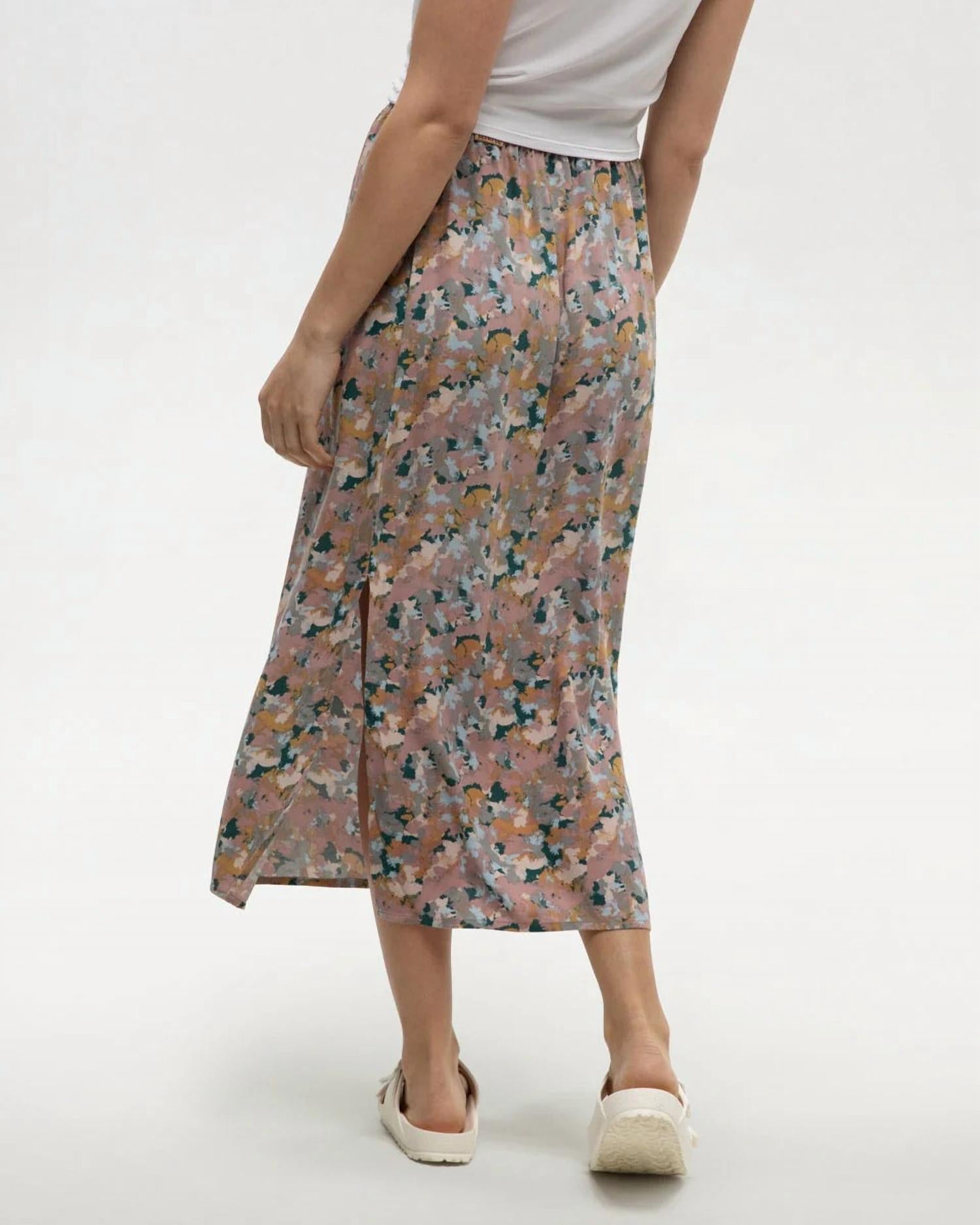 Midi-length floral skirt with side slit, back view on model with white top and espadrilles