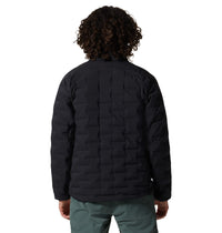 Men's quilted insulated jacket in black, back view on model with curly hair