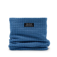 Quilted fleece neck warmer gaiter in medium blue, folded flat, front view with brand label