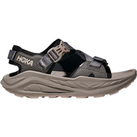 Black and gray hiking sandal with adjustable straps and chunky sole, side profile view