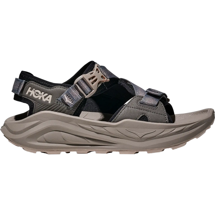 Black and gray hiking sandal with adjustable straps and chunky sole, side profile view