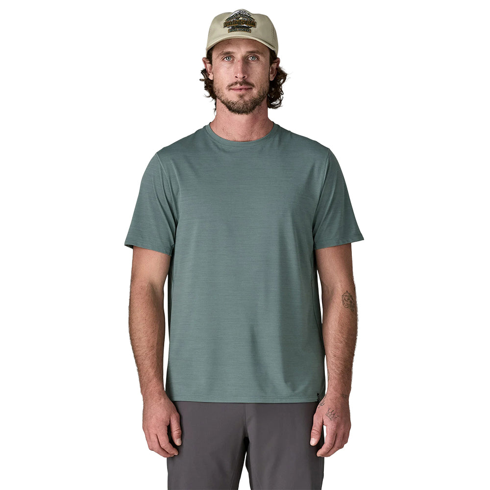 Men wearing sage green short-sleeve performance t-shirt with baseball cap, front view