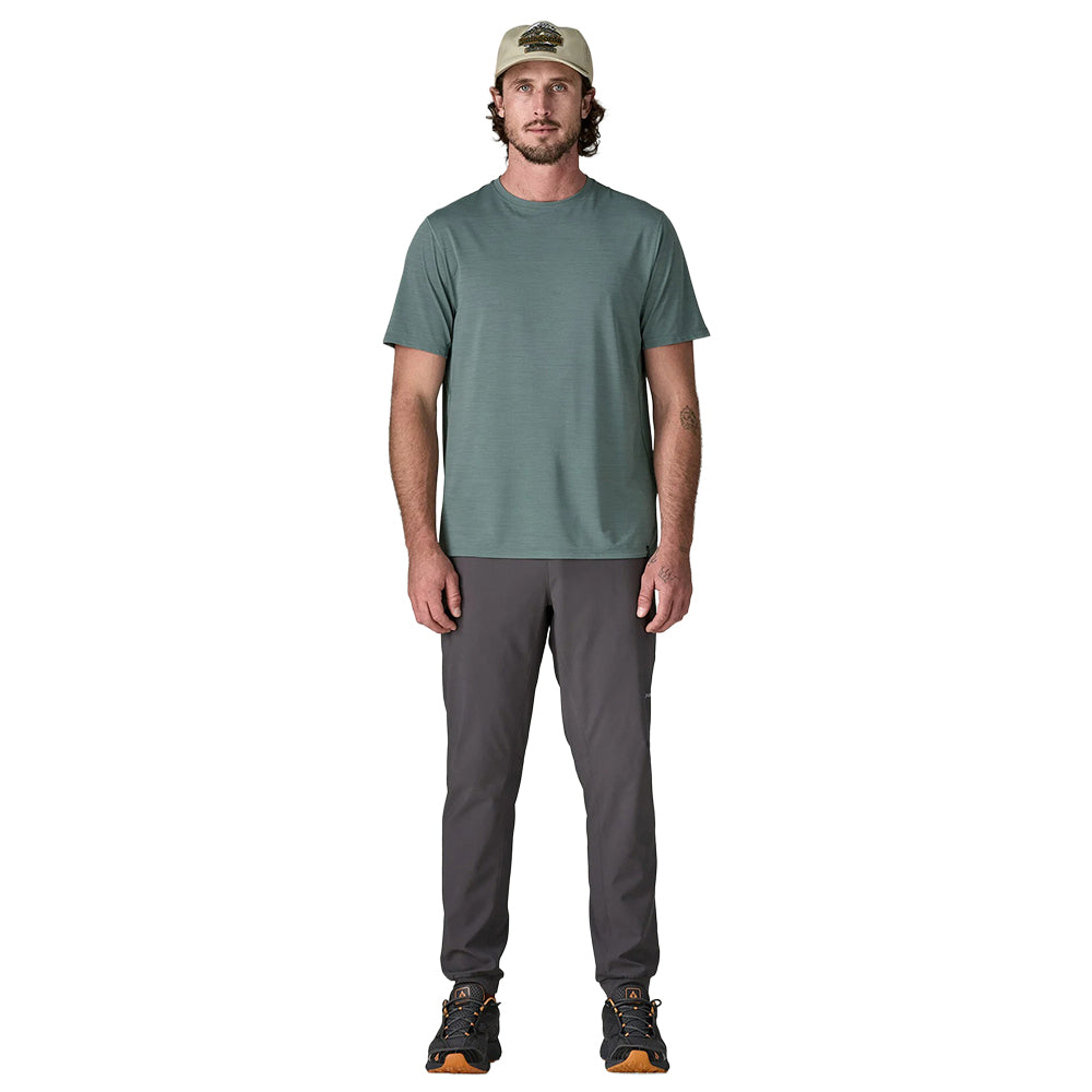 Sage green short-sleeve crew neck t-shirt on male model with gray pants