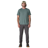 Sage green short-sleeve crew neck t-shirt on male model with gray pants