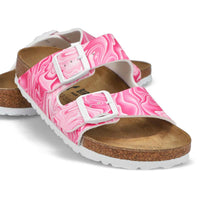 Pink marbled two-strap sandals with cork footbed and white buckles, angled view