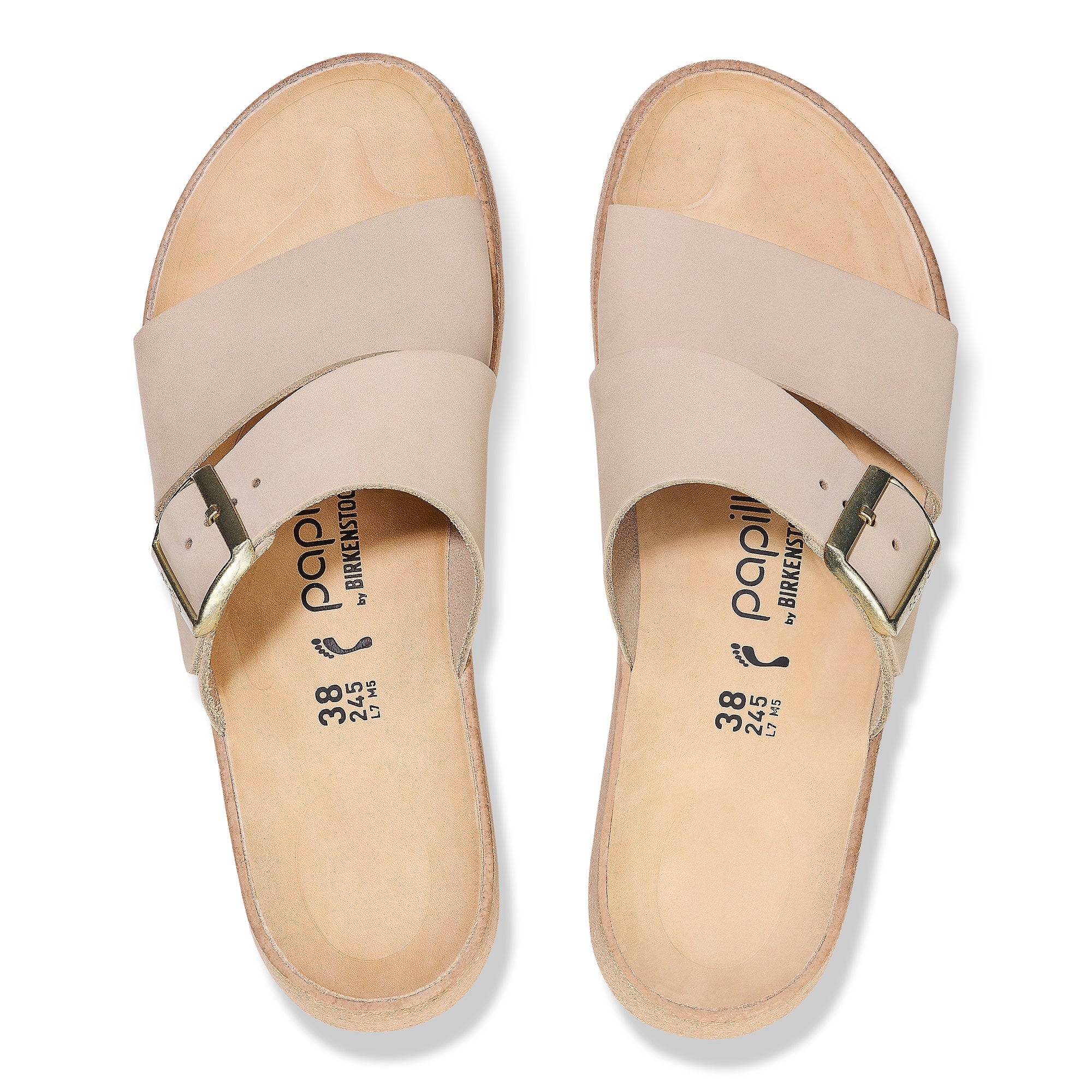 Light beige leather sandals with wide crossover straps and adjustable ankle buckles, top view