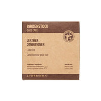 Brown and beige leather conditioner product box with care instructions and volume information