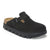 Black suede closed-toe clog with side buckle strap and chunky lug sole, angled view