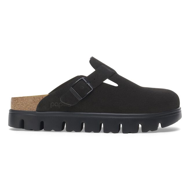 Black suede clog with buckle strap, cork footbed, and chunky lug sole, side view