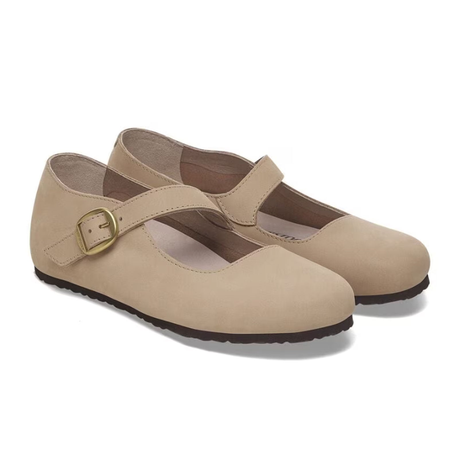 Light tan Mary Jane shoes with buckle strap and textured sole