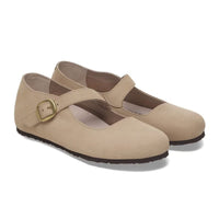 Light tan Mary Jane shoes with buckle strap and textured sole