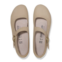 Light tan leather mary jane shoes with ankle strap and buckle closure, top view