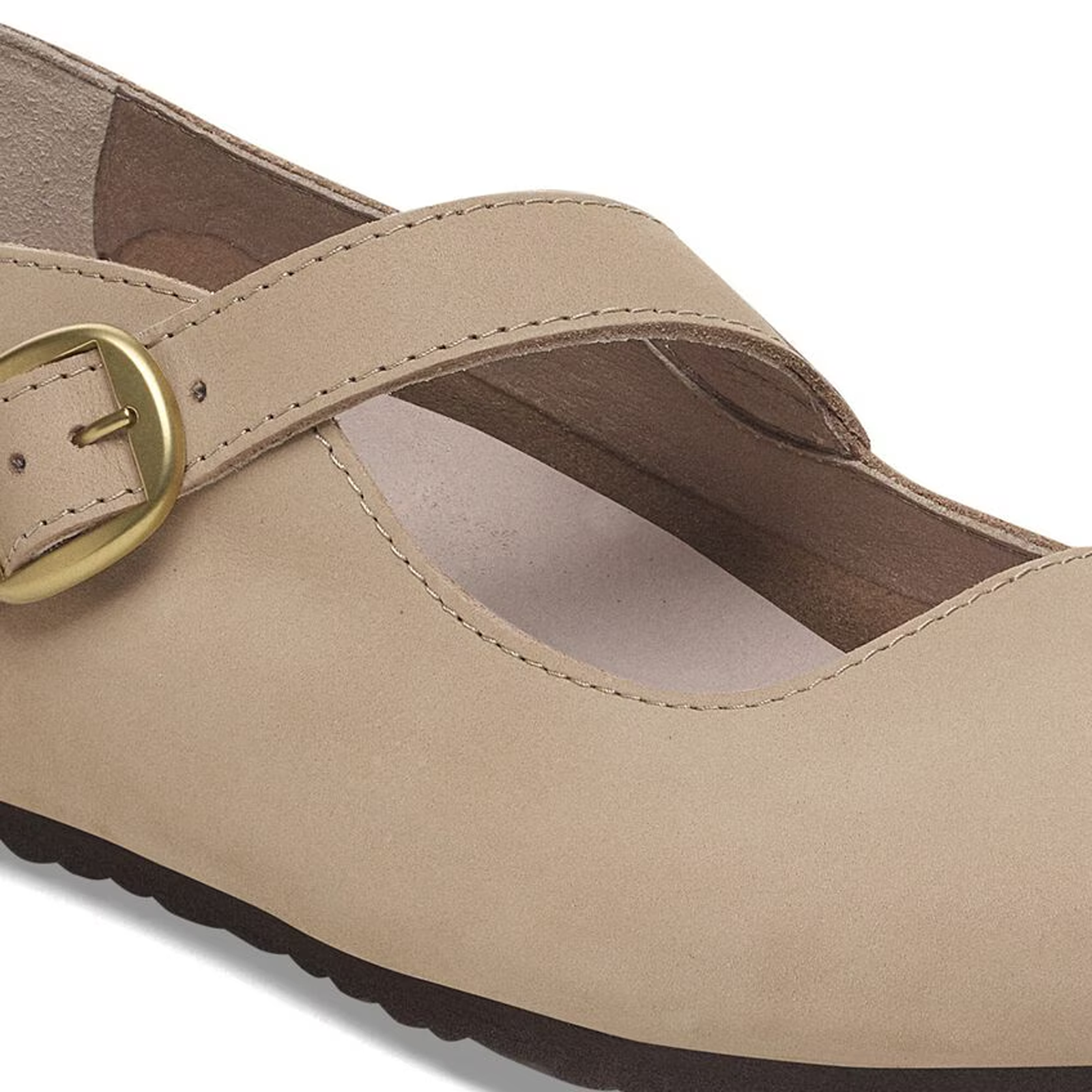 Light beige leather mary jane shoe with adjustable buckle strap, close-up detail view
