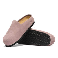 Suede slip-on clogs with closed toe, shown stacked to display rubber outsole tread pattern