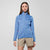 Light blue fleece jacket with full zip and stand collar worn by woman, front view