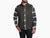 Men's sleeveless vest with zip pockets and stand collar, worn over plaid flannel shirt, front view