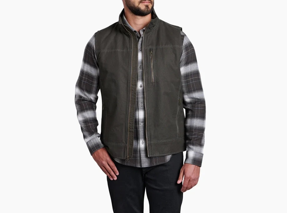 Men's sleeveless vest with zip pockets and stand collar, worn over plaid flannel shirt, front view