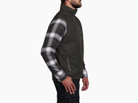 Men's sleeveless vest in dark olive, side view, worn over plaid flannel shirt