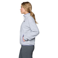 Light gray fleece half-zip pullover shown from side profile with hand in pocket