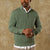 Man wearing sage green quarter-zip sweater over white collared shirt