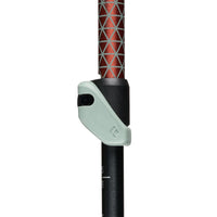 Close-up detail of trekking pole adjustment clamp mechanism with red patterned grip section