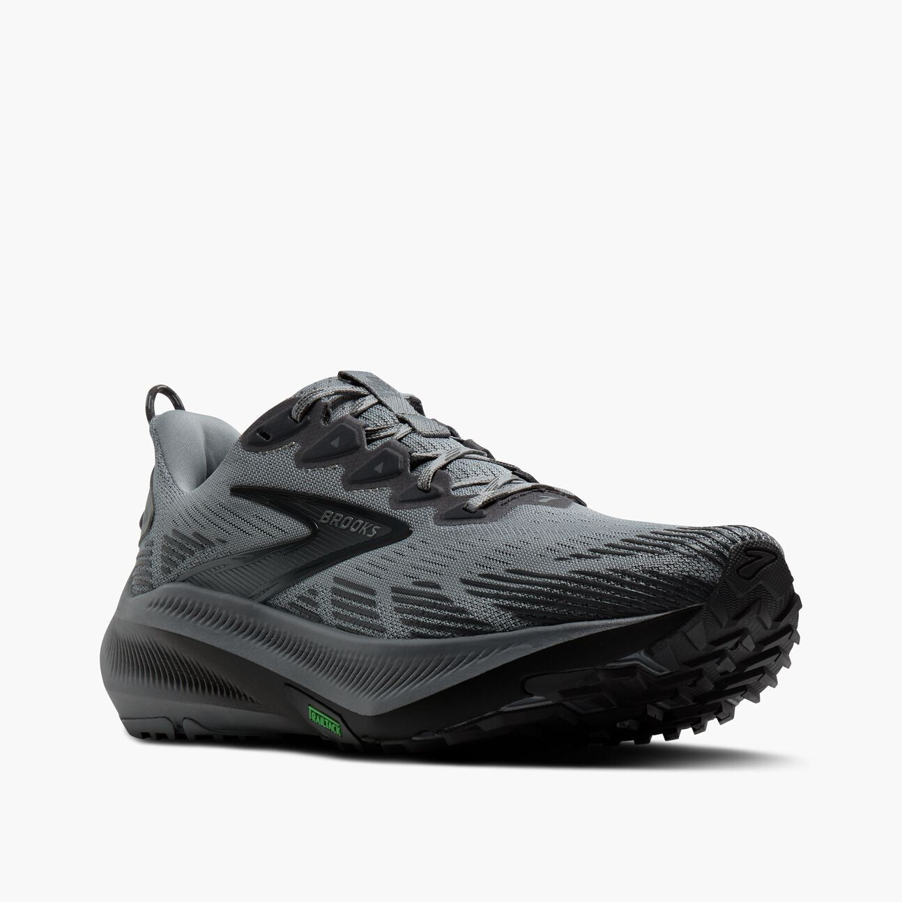 Gray and black mesh trail running shoe with textured outsole, side angle view
