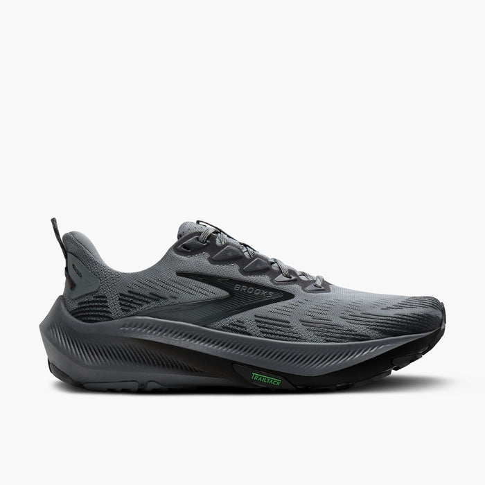Grey trail running shoe with black accents, side view on white background