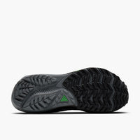 Dark gray trail running shoe sole view showing aggressive tread pattern and grip design