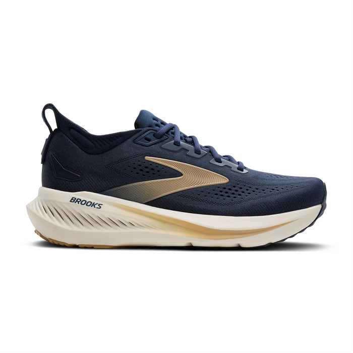 Navy blue running shoe with gold logo stripe and cream midsole, side profile view