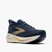 Men's running shoe in navy blue with gold accents and thick cream midsole, three-quarter front view