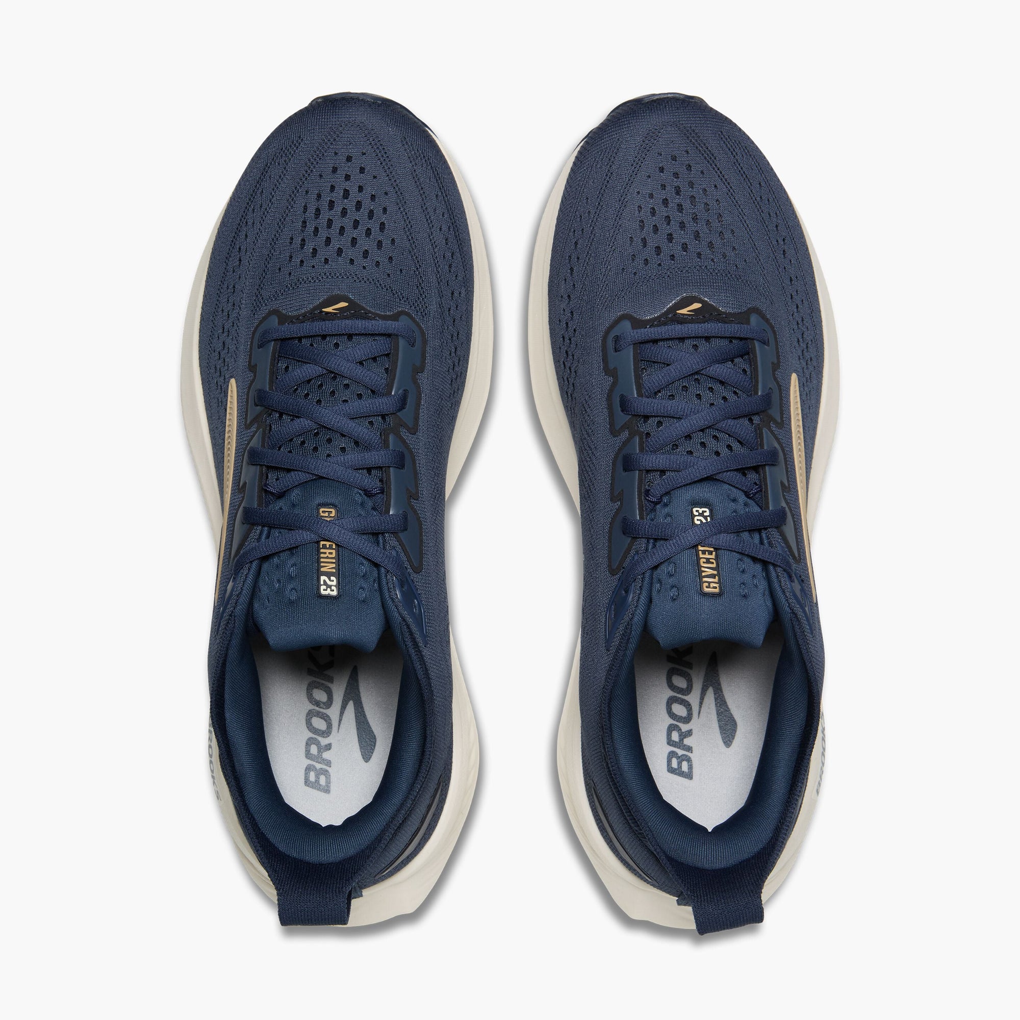 Top-down view of a pair of navy blue running shoes with gold accents and lace-up closure