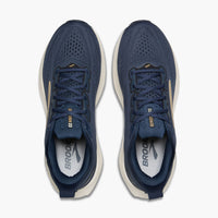 Top-down view of a pair of navy blue running shoes with gold accents and lace-up closure