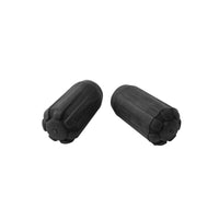Pair of black rubber trekking pole tip protectors with ribbed texture and petal-shaped base, studio view