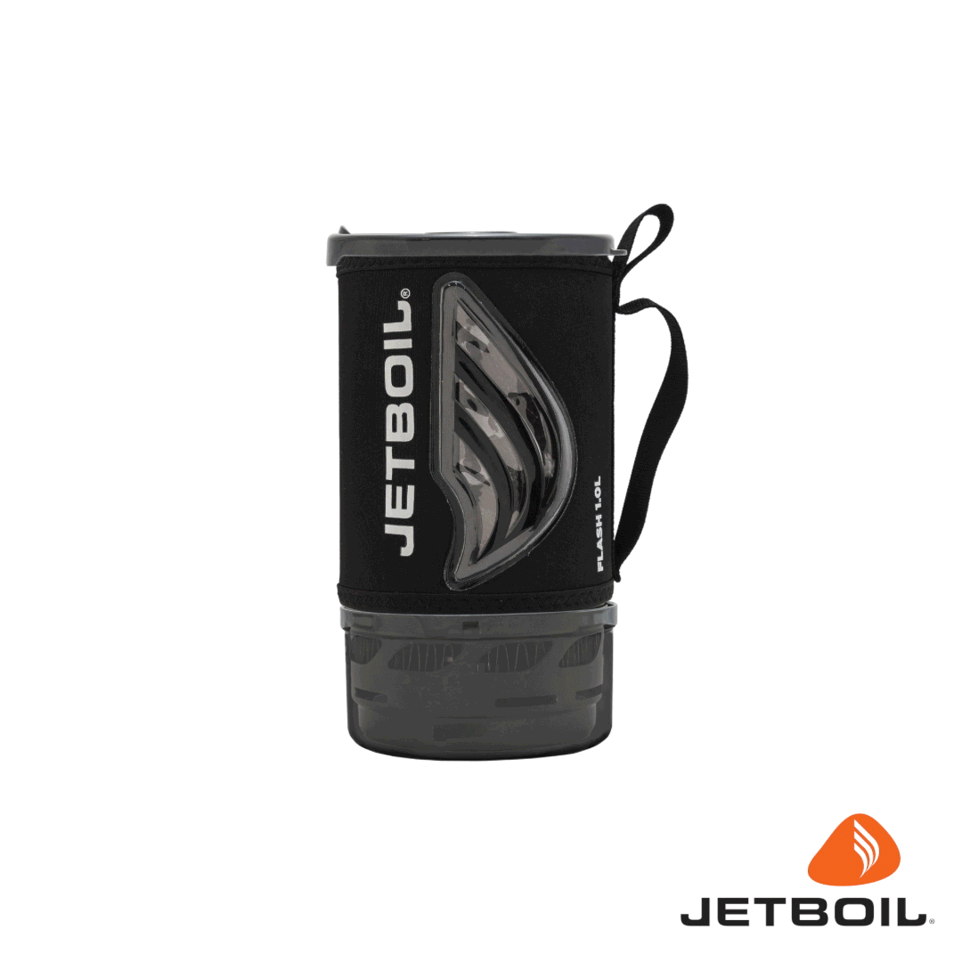 Compact camping cooking system with black insulating sleeve, clear window, and handle loop