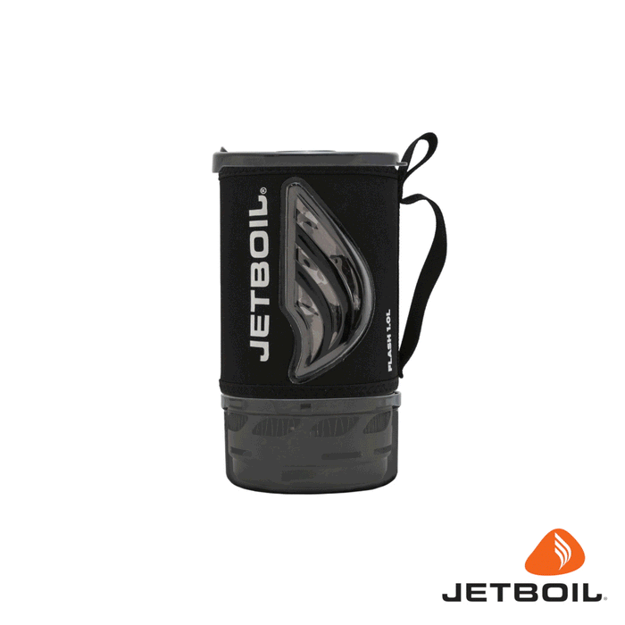 Compact camping cooking system with black insulating sleeve, clear window, and handle loop