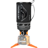 Compact camping stove system with black insulated cup mounted on gas canister with orange stabilizer legs