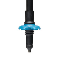 Close-up of trekking pole lower section showing blue star-shaped basket and carbide tip