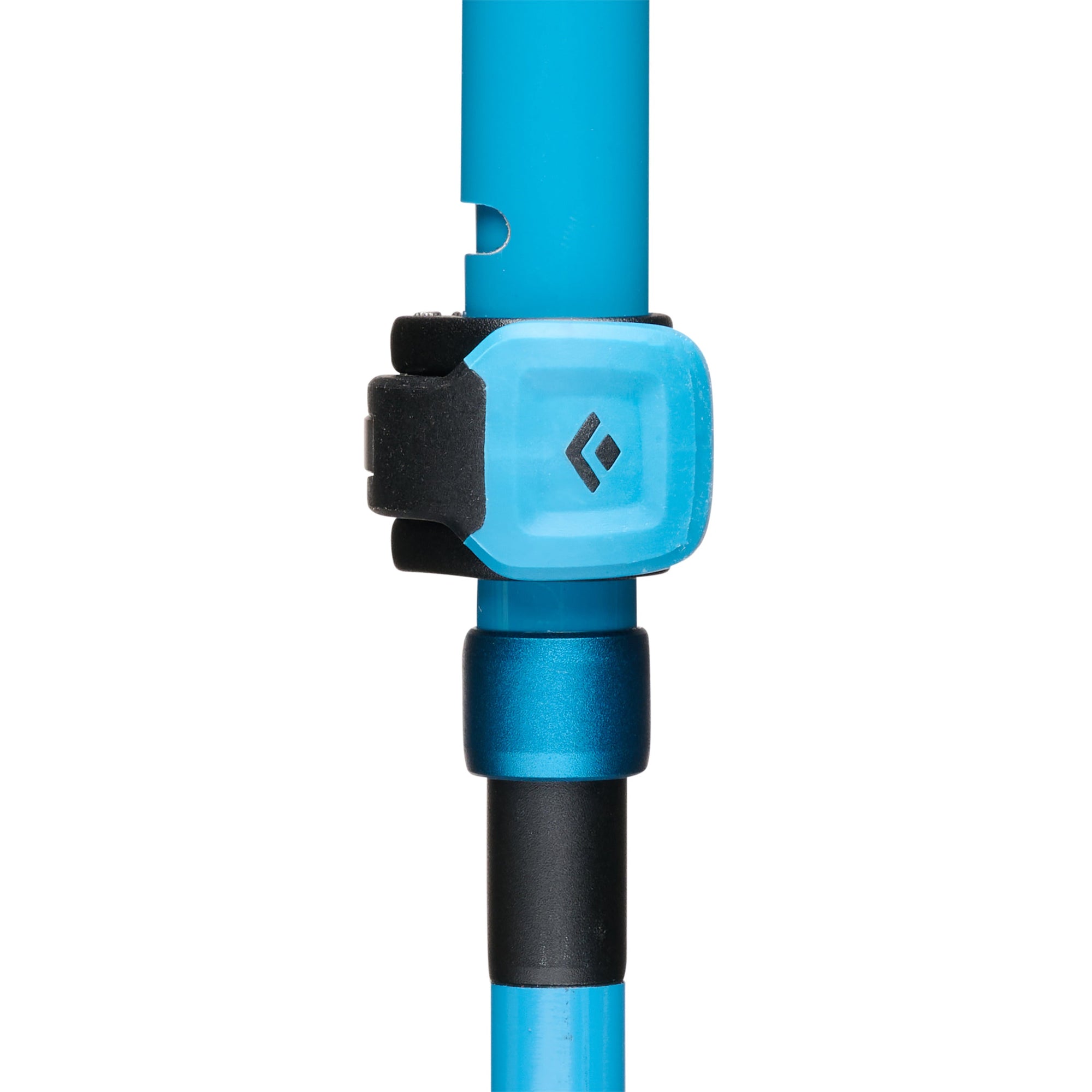 Close-up detail of trekking pole FlickLock adjustment mechanism with branded logo