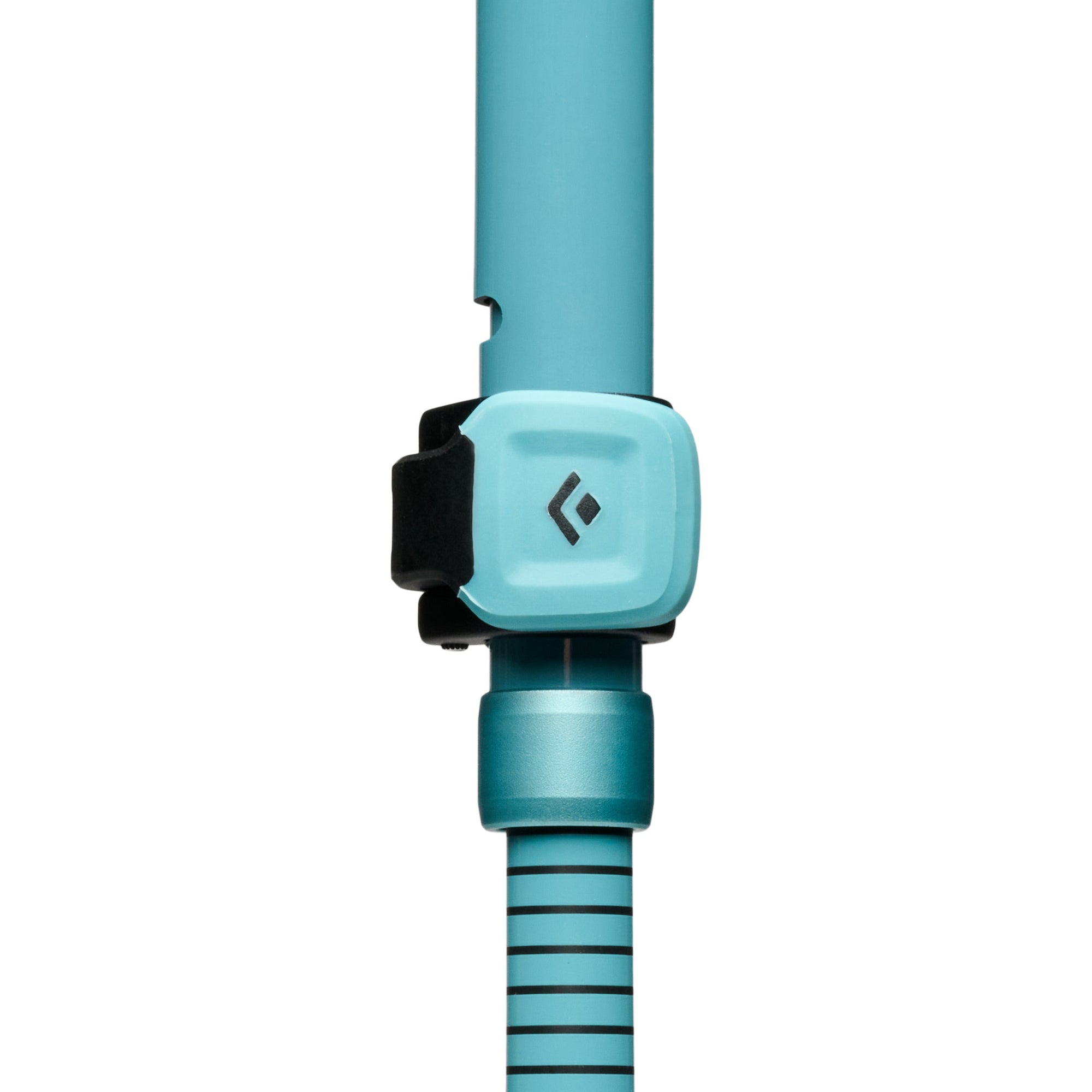 Close-up detail of trekking pole FlickLock adjustment mechanism with branded clasp