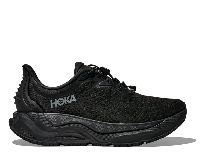 Black athletic running shoe with textured midsole and lace-up closure, side profile view