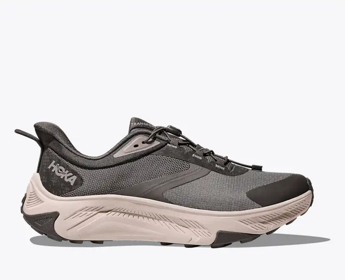 Men's trail running shoe with dark gray mesh upper and chunky cream midsole, lateral view